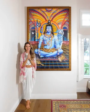 Juliana Garces beside her artwork